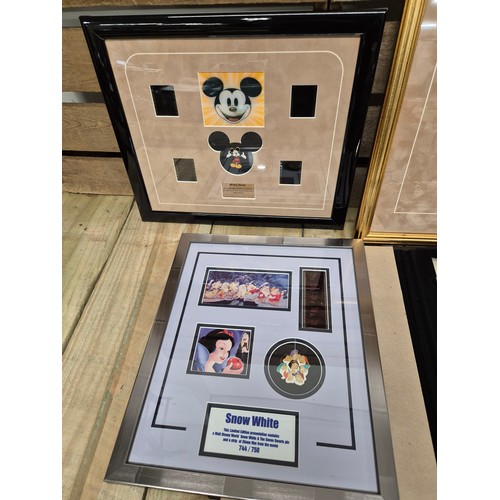 323 - A collection of three Walt Disney film cells together with Disney showcase plaques; Mickey Mouse, Th... 