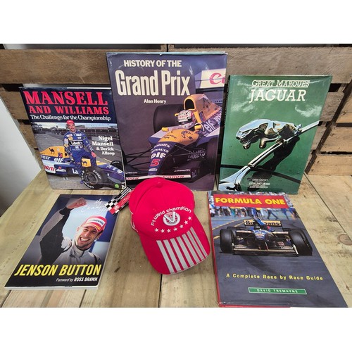 324 - A collection of formula one racing car & Jaguar books together with formula one Michael Schumacher c... 