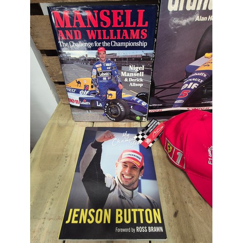 324 - A collection of formula one racing car & Jaguar books together with formula one Michael Schumacher c... 