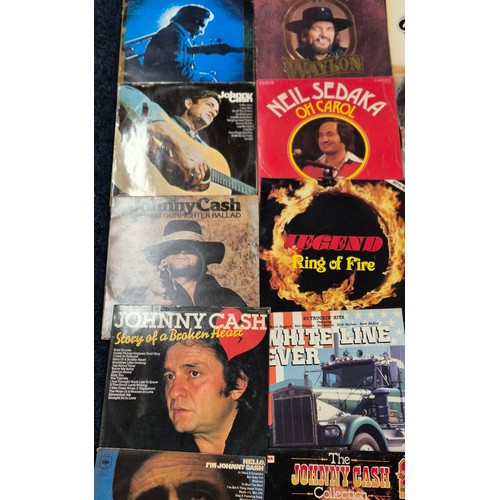 336 - A collection of country music LPs; Johnny Cash, Waylon, Neil Sedaka, 20 trucking hits white line fev... 