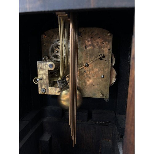 122 - Antique oak grandmother clock, Shaped top section, leading down to number dial, having barley twist ... 