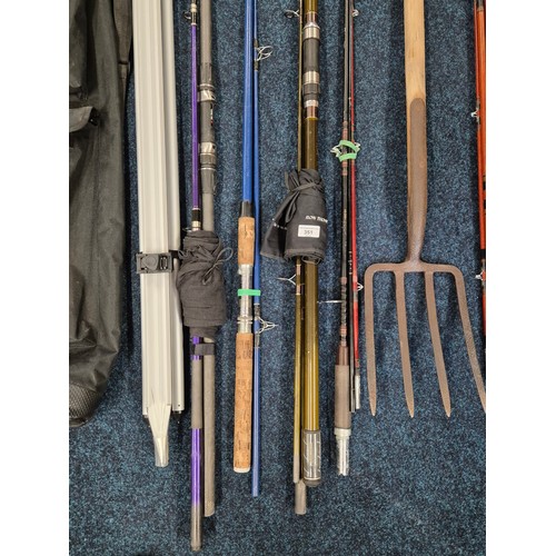 351 - A collection of various fishing rods & fishing stand together with bait fork;  Abu Garcia fishing ro... 