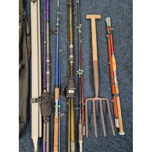 351 - A collection of various fishing rods & fishing stand together with bait fork;  Abu Garcia fishing ro... 