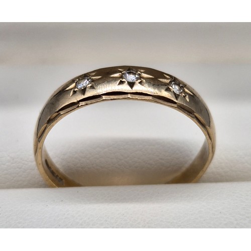 7 - 9ct yellow gold ring set with three round cut diamonds. [Ring size W] [2.80Grams]