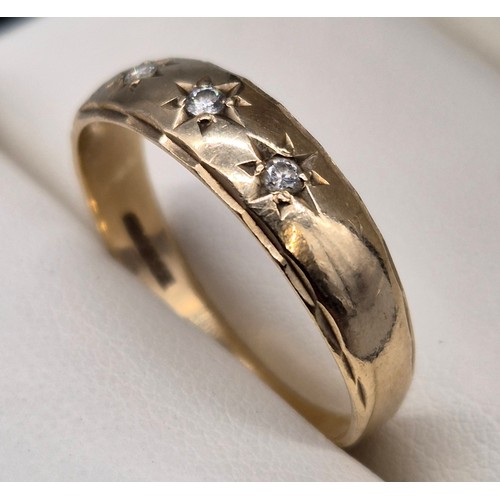 7 - 9ct yellow gold ring set with three round cut diamonds. [Ring size W] [2.80Grams]