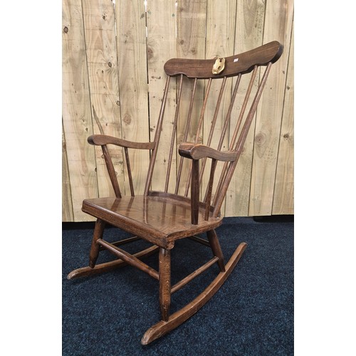 221 - Mid century oak spindle back rocking chair