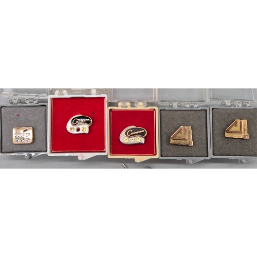 14 - Four 10ct gold pins and three 10ct gold 1/5th and 1/10th pins. fitted with various gem stones. [four... 