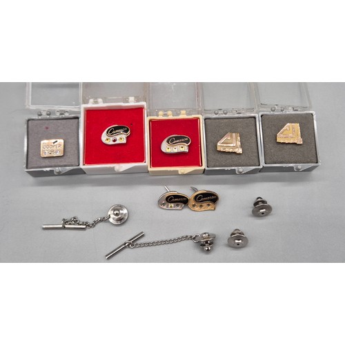 14 - Four 10ct gold pins and three 10ct gold 1/5th and 1/10th pins. fitted with various gem stones. [four... 