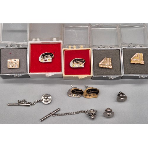 14 - Four 10ct gold pins and three 10ct gold 1/5th and 1/10th pins. fitted with various gem stones. [four... 