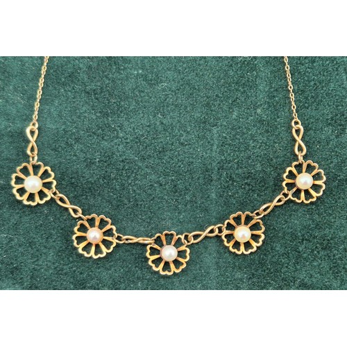 22 - 9ct yellow gold and pearl set floral design necklace. [5grams]