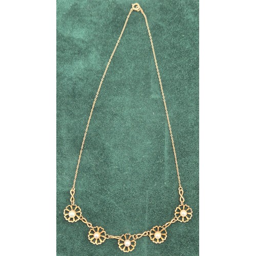 22 - 9ct yellow gold and pearl set floral design necklace. [5grams]