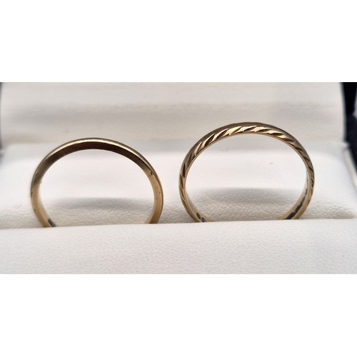 24 - Two 9ct yellow gold wedding bands. [Ring size O & M] [2.74Grams]