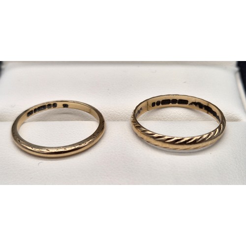 24 - Two 9ct yellow gold wedding bands. [Ring size O & M] [2.74Grams]