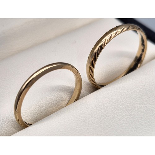 24 - Two 9ct yellow gold wedding bands. [Ring size O & M] [2.74Grams]