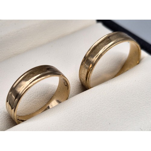 23 - Two matching 9ct yellow gold wedding bands. [Ring size R & L] [4.40Grams]