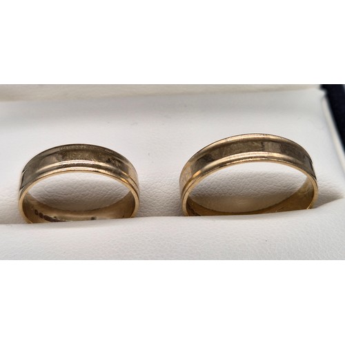 23 - Two matching 9ct yellow gold wedding bands. [Ring size R & L] [4.40Grams]