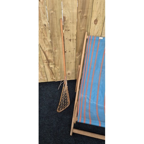 374 - Vintage deck chair together with Two vintage Lacrosse sticks with leather and cat gut heads [114cm l... 