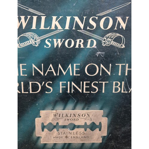 373 - A vintage Wilkinson sword blade brand advertising sign [47.5x74cm]