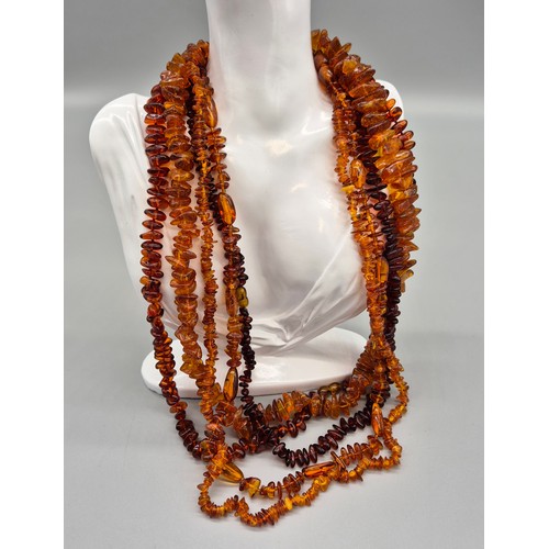 27 - A collection of five vintage amber necklaces. Varying sizes. [177.52grams]