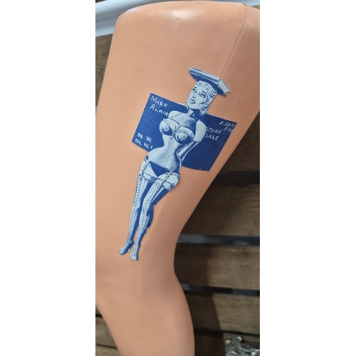 364 - A collection of erotic caricatures prints together with erotic manikin display legs on stands