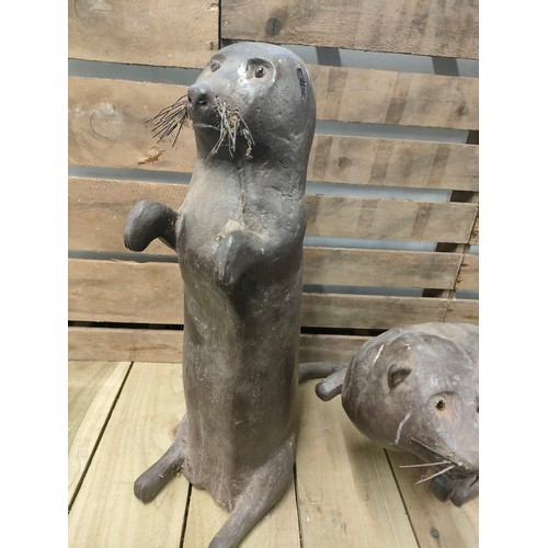 231 - Two large Hand carved otter sculptures [56cm High]