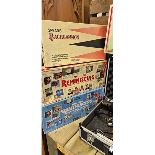 499 - Two boxes of vintage tools together with a selection of board games; monopoly & Reminiscing