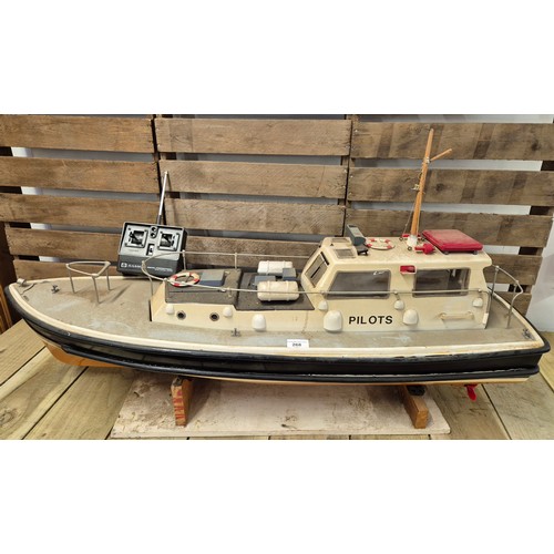 268 - Large Sanwa Remote control model boat on stand with original remote