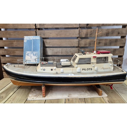 268 - Large Sanwa Remote control model boat on stand with original remote