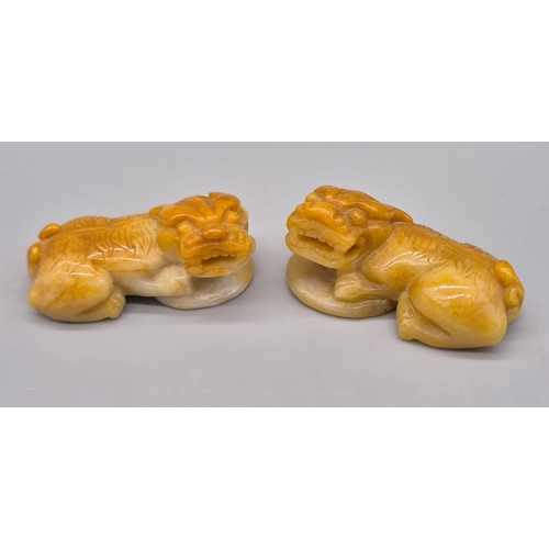 32 - A Pair of Chinese hand carved white jade left and right facing foo dogs sculptures. [4.5cm length]