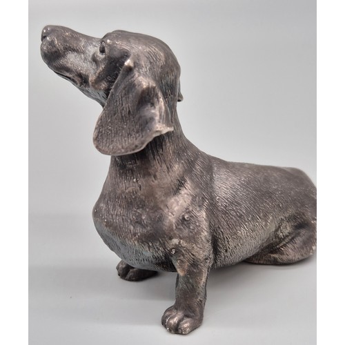 33 - Sheffield silver seated Dachshund sculpture. Silver filled. [8x9.5x4cm]