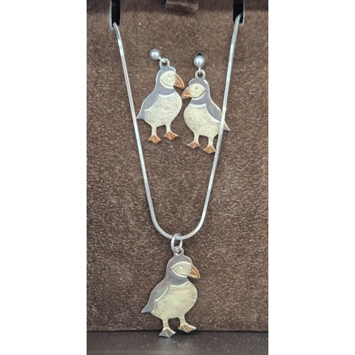 39 - 925 silver puffin pendant and matching earrings. Comes with a silver necklace.