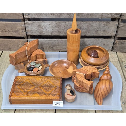 403 - A Tray of carved wooden Treen collectables; quiche dish, puffin figure, dolphins & other items