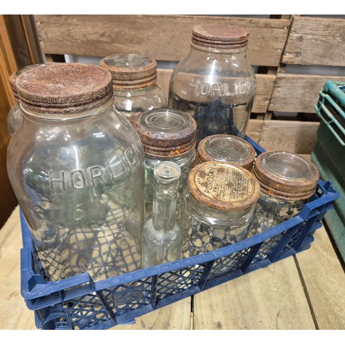 494 - A crate of tools, camping gas stoves; together with a crate of advertising glass jars