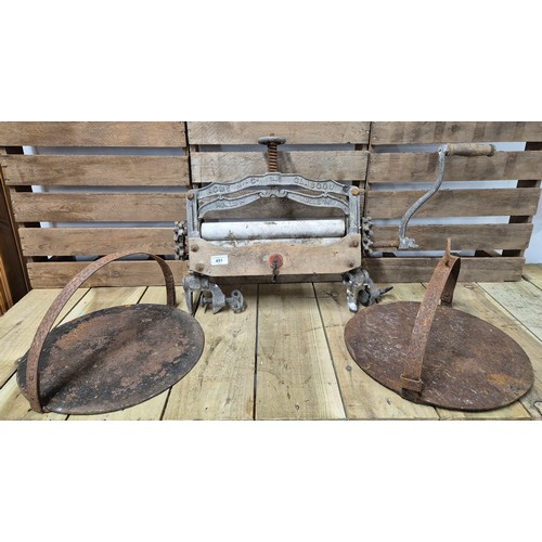 491 - Two antique skillets together with acme antique wringer