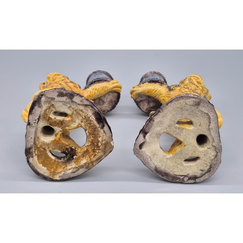 127 - A Pair of antique Majolica lion candle stick holders. [16cm high] [Old repairs to base]