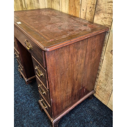 243 - Early 19th century leather top desk, fitted with brass swing handles. Rectangle top fitted with red ... 