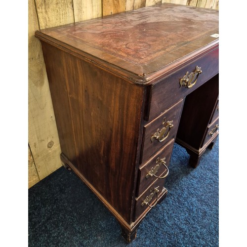 243 - Early 19th century leather top desk, fitted with brass swing handles. Rectangle top fitted with red ... 