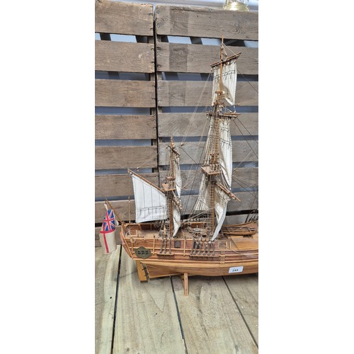 244 - Large hand made wooden  galleon ship raised on a stand [64x77cm]