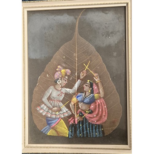 248 - Three hand painted Indian paintings done on leaves, depicting figures and taj mahal