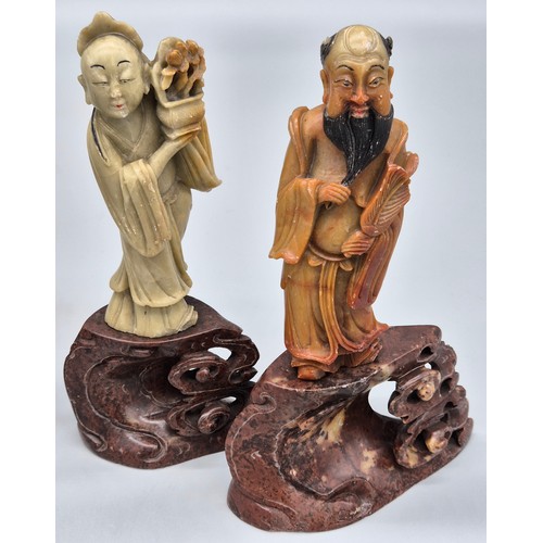 143 - Four various Chinese soapstone carved figures raised on carved stands in the form of clouds. [Talles... 