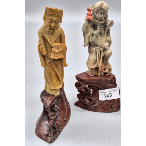 143 - Four various Chinese soapstone carved figures raised on carved stands in the form of clouds. [Talles... 