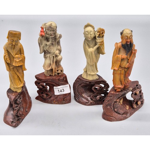 143 - Four various Chinese soapstone carved figures raised on carved stands in the form of clouds. [Talles... 