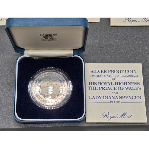 63 - Five Boxed Royal Mint Solid Sterling Silver proof coins.