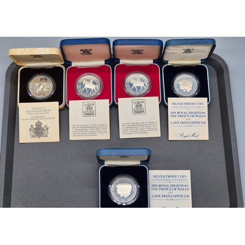 63 - Five Boxed Royal Mint Solid Sterling Silver proof coins.