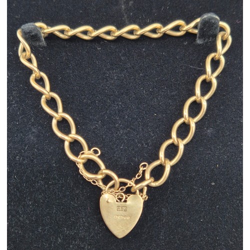 6 - 9ct yellow gold bracelet with heart lock attached. [14.29grams]