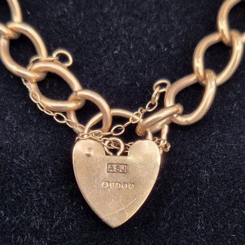 6 - 9ct yellow gold bracelet with heart lock attached. [14.29grams]