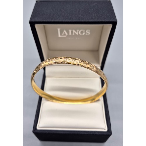 11 - 14ct yellow gold bangle. [11.31grams]