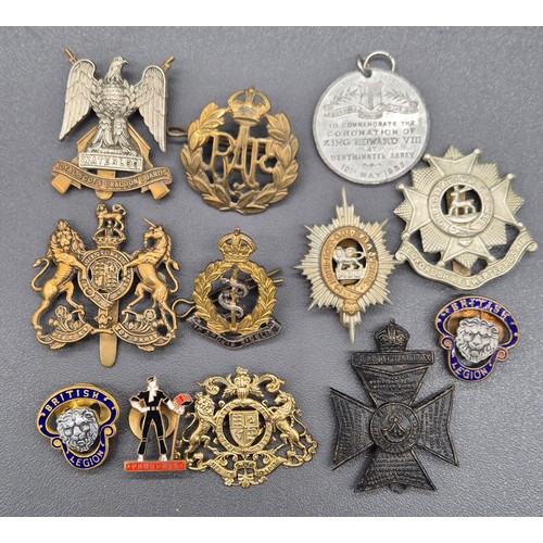44 - A Selection of military cap badges and other related items; Waterloo Royal Scots Dragoon Guards cap ... 