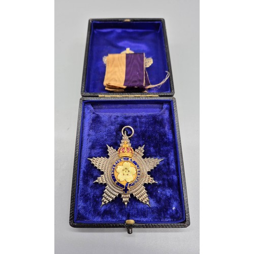 47 - A Boxed Primrose League order enamelled star medal with ribbon.