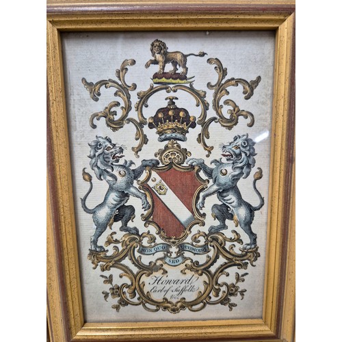 56 - Four 19th century coloured engraving family crests. Fitted within matching frames [22.5x16.5cm]